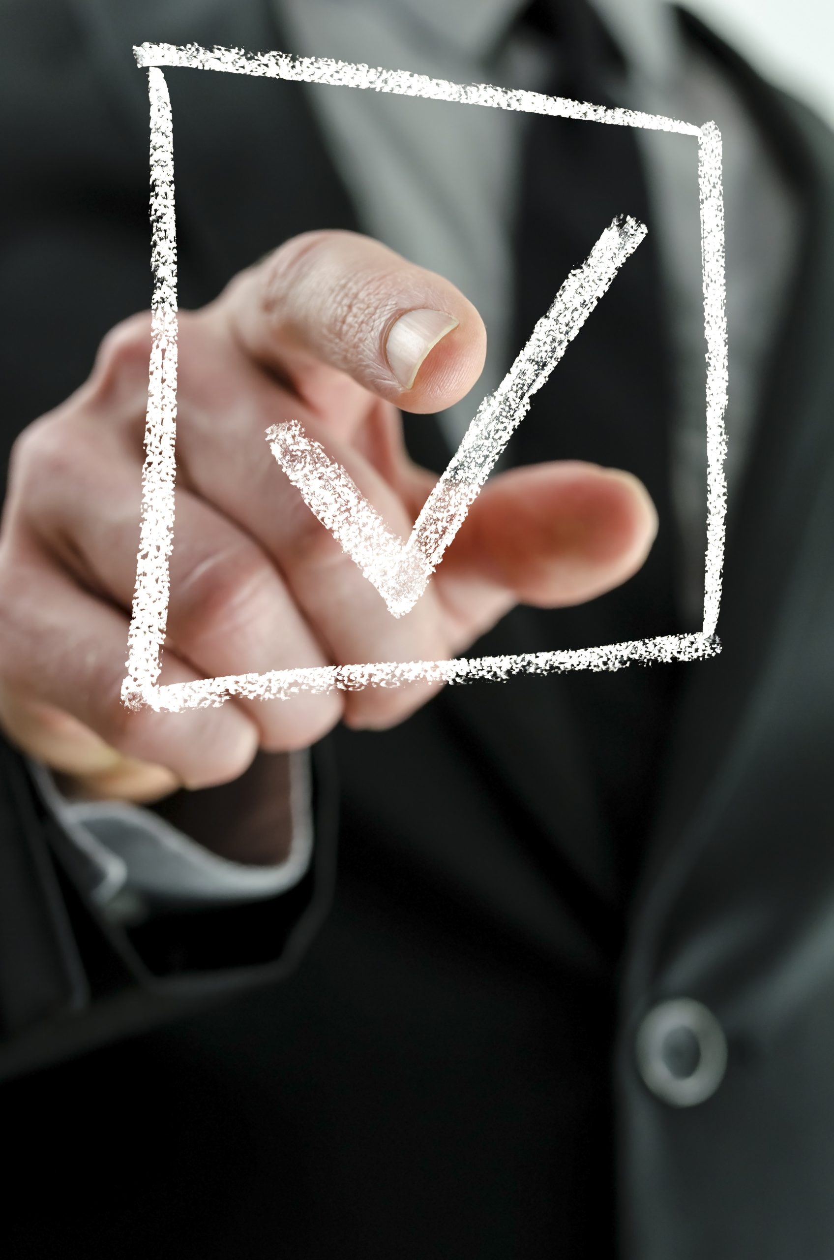 Business man making a checkmark